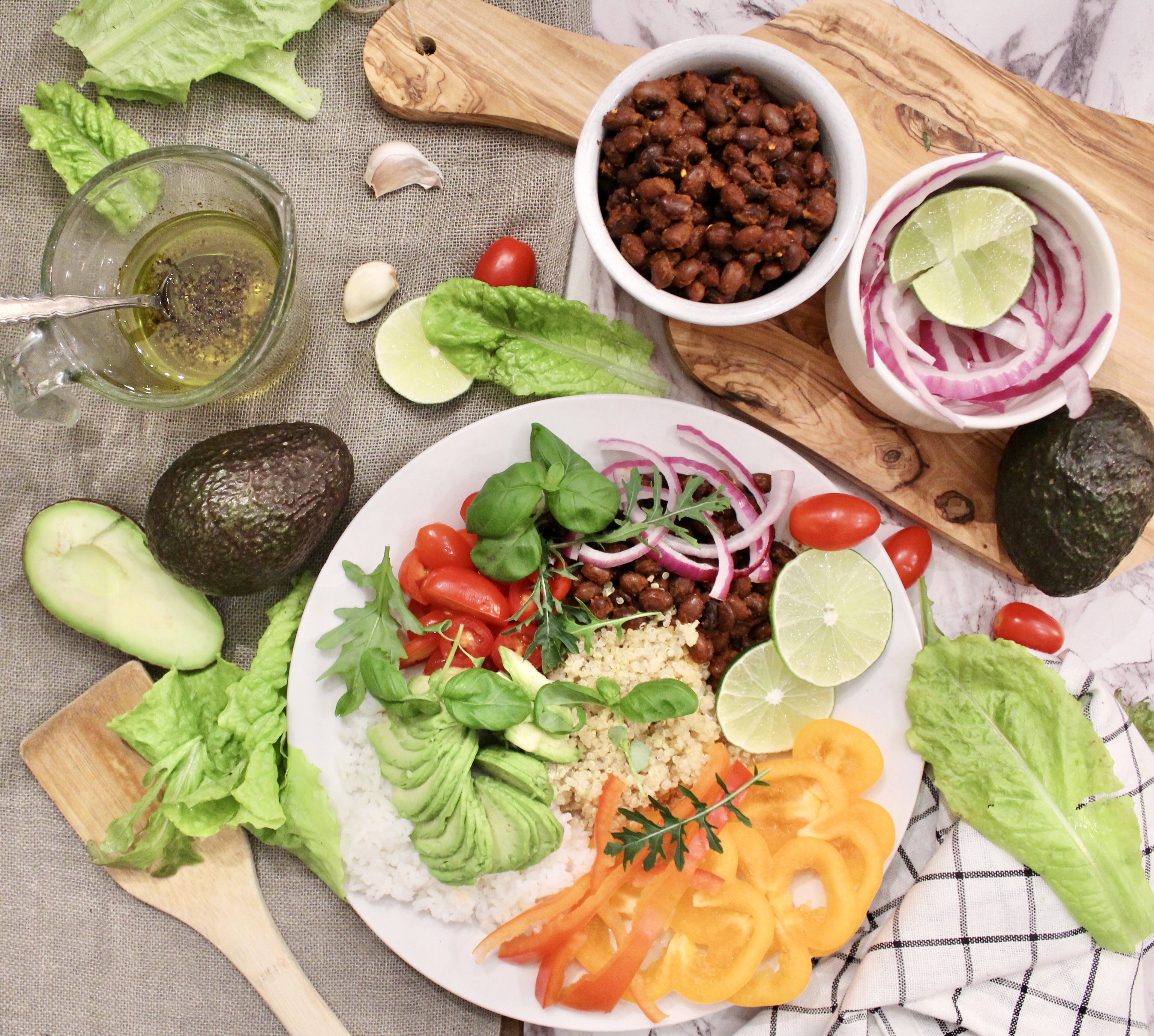 Overhead view of black bean quinoa rice and avocado bowl ingredients